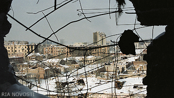 Grozny, viewed through bombed-out wall