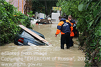 Flood Scene file photo with Flooded Cars, Emergency Personnel