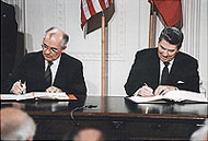File Photo of Mikhail Gorbachev and Ronald Regan Signing Papers