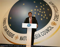 File Phot of Diplomat a Podium Before NATO-Russia Council Logo