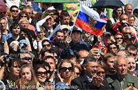 File Photo of Russian Crowd with Someone Waving Russian Flag