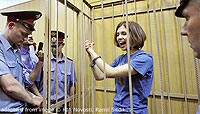 Pussy Riot Member in Handcuffs in Courtroom Cage