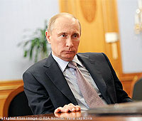 File Photo of Vladimir Putin Sitting at Desk