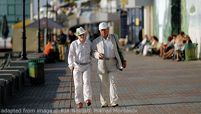 File Photo of Elders Walking Along Boardwalk, One Using Cane