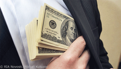 Hand of Man in Suit Putting Cash Into Inside Suit Pocket