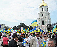 File Photo of Ukrainian Crowds With Ukrainian Flags Next to Church with Onion Domes